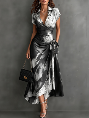 Vestido midi cruzado con estampado abstracto blanco, escote en V, manga corta, cintura anudada y bajo asimétrico con volante