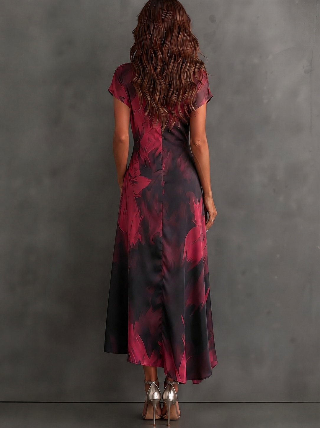 Vestido midi cruzado con estampado abstracto rojo y negro, escote en V, manga corta, cintura anudada y bajo asimétrico con volante