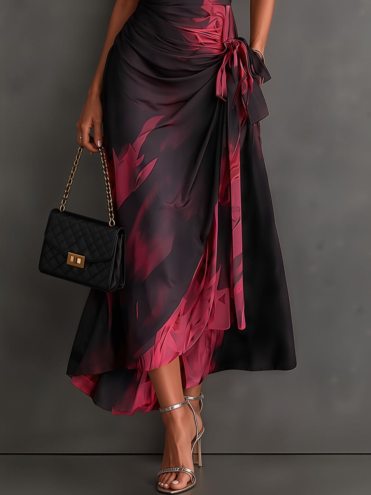 Vestido midi cruzado con estampado abstracto rojo y negro, escote en V, manga corta, cintura anudada y bajo asimétrico con volante
